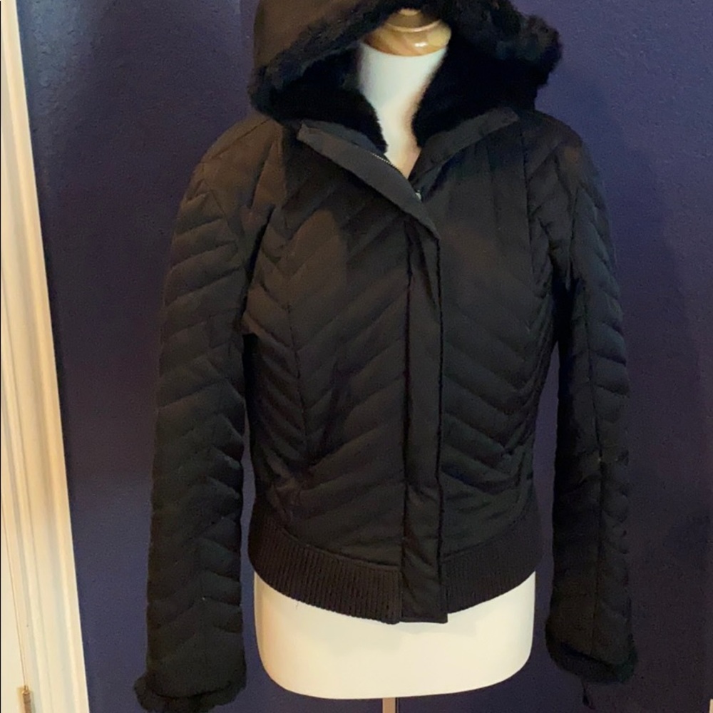Ladie black fur hooded zip up jacket.